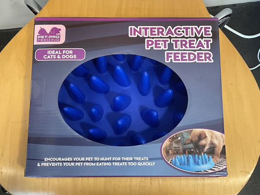 Interactive pet treat feeder