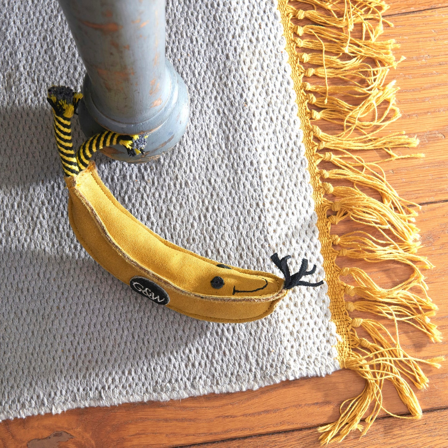 Barry the Banana showing jute filling on rug